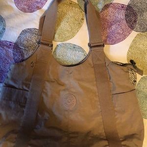 Kipling live light purse satchel, tan colored.